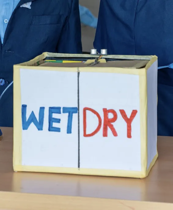 A waste-sorting bin that separates wet and dry rubbish, built by Maskido pupils